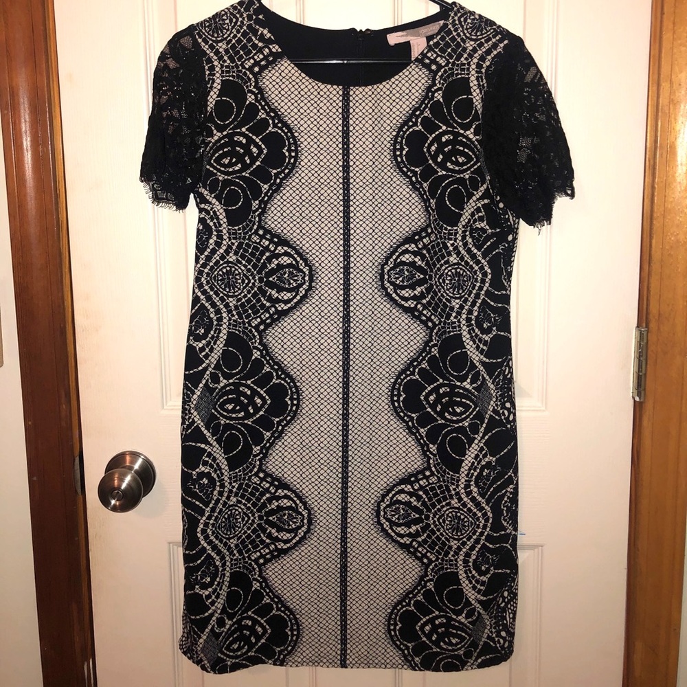 Black and white dress with unique design.